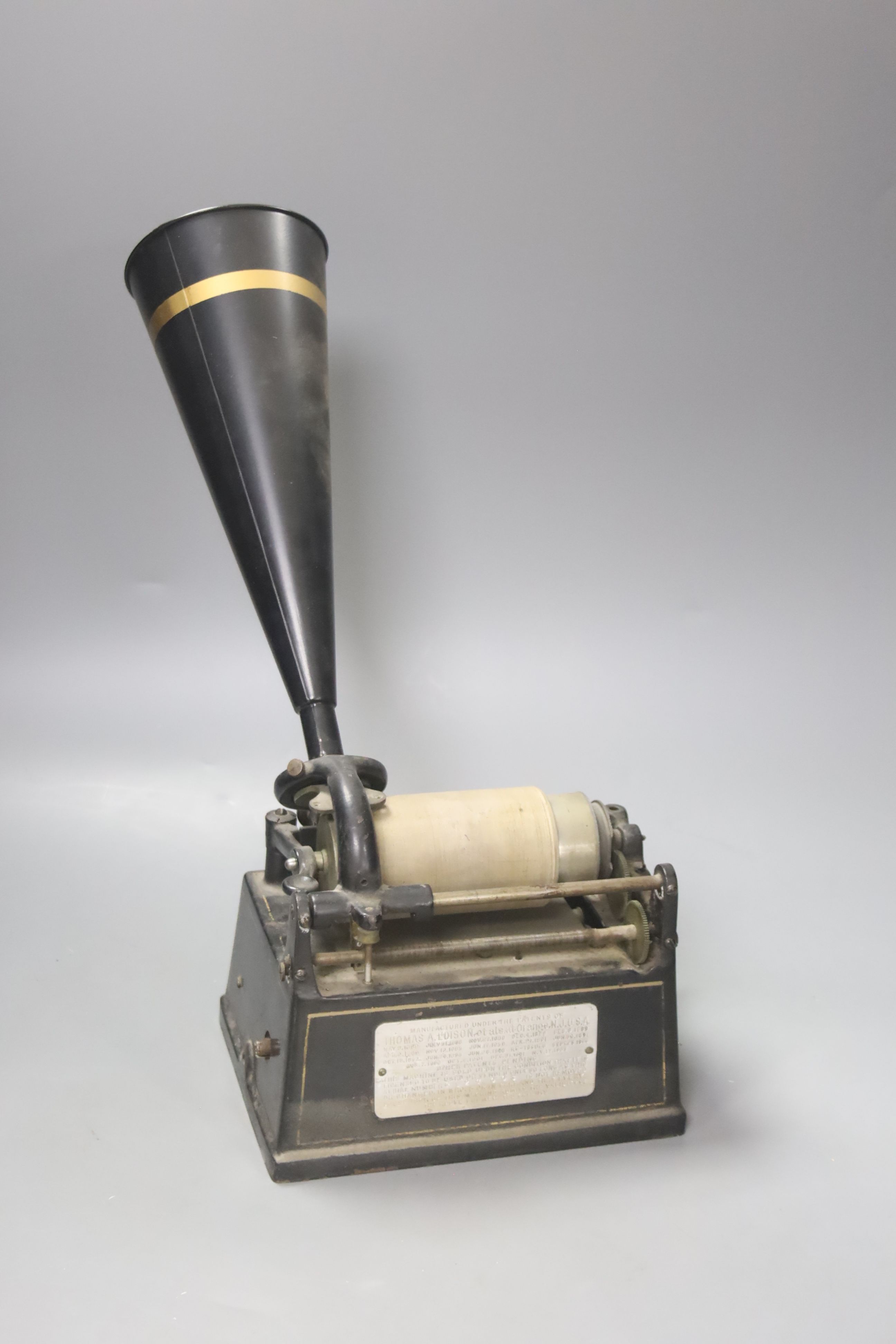 An Edison Gem phonograph, fitted with a horn, with original black and gilt bordered finish, 20cm wide, 15cm deep, 37cm high.